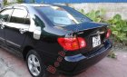 Toyota Corolla 1.3MT 2003 - Cần bán lại xe Toyota Corolla 1.3MT đời 2003, màu đen xe gia đình
