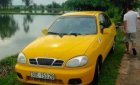 Daewoo Lanos SX 2002 - Cần bán lại xe Daewoo Lanos SX 2002, màu vàng, giá 79tr