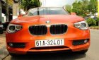 BMW 1 Series  116i  2014 - Chính chủ bán BMW 1 Series 116i đời 2014, màu cam