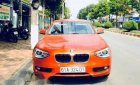 BMW 1 Series  116i  2014 - Chính chủ bán BMW 1 Series 116i đời 2014, màu cam