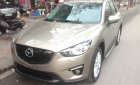 Mazda CX 5 2WD 2013 - Cần bán xe Mazda CX-5, sản xuất và đăng ký 2013 mầu vàng cát. Giá 665 triệu
