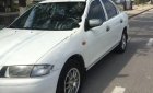 Mazda 323 2000 - Cần bán xe Mazda 323 sản xuất năm 2000, màu trắng
