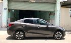 Mazda 2 AT 2016 - Bán Mazda 2 AT sản xuất năm 2016, màu nâu xe gia đình