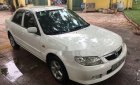 Mazda 323 2002 - Cần bán xe Mazda 323 năm sản xuất 2002, màu trắng, giá chỉ 215 triệu