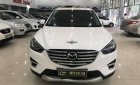 Mazda CX 5 2.0AT 2016 - Cần bán gấp Mazda CX 5 2.0AT sản xuất năm 2016, màu trắng số tự động