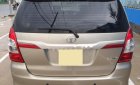 Toyota Innova E 2014 - Bán ô tô Toyota Innova E đời 2014, màu vàng số sàn