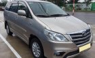 Toyota Innova E 2014 - Bán ô tô Toyota Innova E đời 2014, màu vàng số sàn