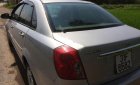 Daewoo Lacetti EX 2010 - Gia đình bán Daewoo Lacetti 1.6 sản xuất năm 2010, màu vàng cát