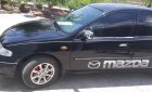 Mazda 323 2000 - Cần bán xe Mazda 323 Đu sản xuất 2000, màu đen, nhập khẩu