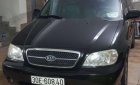 Kia Carnival 2005 - Cần bán Kia Carnival năm sản xuất 2005, màu đen xe gia đình, giá chỉ 340 triệu