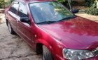 Ford Laser Ghia 1.8 MT 2003 - Chính chủ bán ô tô Ford Laser Ghia 1.8 MT 2003, màu đỏ