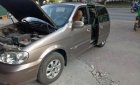 Kia Carnival 2009 - Cần bán Kia Carnival đời 2009, màu vàng