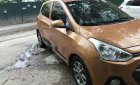 Hyundai Grand i10 2015 - Bán Hyundai Grand i10 năm sản xuất 2015, màu đồng