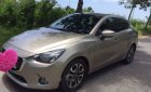 Mazda 2  1.5AT 2016 - Bán Mazda 2 1.5AT sản xuất 2016, màu vàng xe gia đình