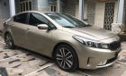 Kia Cerato AT 2016 - Cần bán Kia Cerato AT sản xuất 2016, màu nâu 