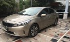 Kia Cerato AT 2016 - Cần bán Kia Cerato AT sản xuất 2016, màu nâu 