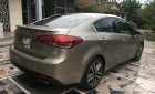 Kia Cerato AT 2016 - Cần bán Kia Cerato AT sản xuất 2016, màu nâu 