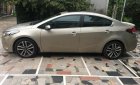 Kia Cerato AT 2016 - Cần bán Kia Cerato AT sản xuất 2016, màu nâu 