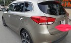 Kia Rondo GAT 2.0 AT 2015 - Bán Kia Rondo GAT 2.0 AT số tự động, model 2016, đời T12/2015, màu vàng cát mới 95%