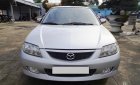 Mazda 323 2003 - Cần Bán Mazda 323 sản xuất 2003, màu bạc, xe gia đình đi