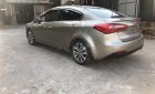 Kia K3 2014 - Bán ô tô Kia K3 đời 2014, màu vàng cát