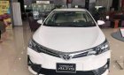 Toyota Corolla altis 1.8 E MT 2018 - Cần bán Toyota Corolla Altis 1.8 E MT sản xuất 2018, màu trắng, xe mới 100%