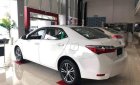 Toyota Corolla altis 1.8 E MT 2018 - Cần bán Toyota Corolla Altis 1.8 E MT sản xuất 2018, màu trắng, xe mới 100%