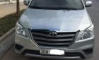 Toyota Innova  2.0E 2014 - Bán gấp Toyota Innova 2.0E đời 2014, màu bạc, số sàn, giá 570tr