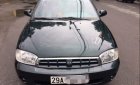 Kia Spectra LS 2004 - Cần bán gấp Kia Spectra LS 2004, màu đen, xe nhập, số sàn