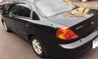 Kia Spectra LS 2004 - Cần bán gấp Kia Spectra LS 2004, màu đen, xe nhập, số sàn