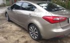 Kia K3 2015 - Cần bán Kia K3 năm sản xuất 2015, màu vàng, giá 450tr