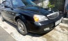 Daewoo Magnus    2004 - Cần bán xe Daewoo Magnus năm sản xuất 2004, màu đen, máy êm