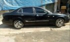 Daewoo Magnus    2004 - Cần bán xe Daewoo Magnus năm sản xuất 2004, màu đen, máy êm