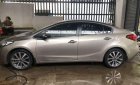 Kia K3 2014 - Bán Kia K3 năm 2014, màu vàng cát