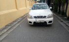 Daewoo Lanos SX 2004 - Gia đình cần bán Daewoo Lanos SX đời 2004, màu trắng, giá 72tr