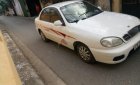 Daewoo Lanos SX 2004 - Gia đình cần bán Daewoo Lanos SX đời 2004, màu trắng, giá 72tr