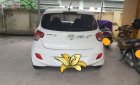 Hyundai Grand i10 2014 - Gia đình cần bán Hyundai Grand i10 2014, màu trắng, xe nhập