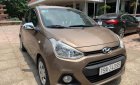 Hyundai Grand i10   MT 2015 - Chính chủ bán lại xe Hyundai Grand i10 MT năm 2015, màu nâu, nhập khẩu nguyên chiếc