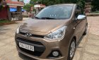 Hyundai Grand i10   MT 2015 - Chính chủ bán lại xe Hyundai Grand i10 MT năm 2015, màu nâu, nhập khẩu nguyên chiếc