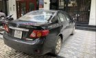 Toyota Corolla altis 2010 - Bán Toyota Corolla Altis đời 2010, màu đen xe gia đình