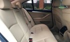 BMW 5 Series 520i 2.0AT 2014 - Chính chủ bán BMW 520i màu trắng kem SX 2015, cửa hít, màn NBT, loa Harman