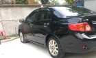 Toyota Corolla altis AT   2009 - Chính chủ bán Toyota Corolla altis AT đời 2009, màu đen, xe nhập