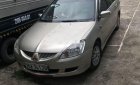 Mitsubishi Lancer 2004 - Chính chủ bán Mitsubishi Lancer đời 2004, màu vàng cát