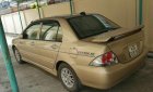 Mitsubishi Lancer 2004 - Cần bán lại xe Mitsubishi Lancer đời 2004, màu vàng xe gia đình, giá chỉ 230 triệu
