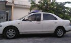 Mazda 323 1999 - Cần bán gấp Mazda 323 sản xuất năm 1999, màu trắng, nhập khẩu