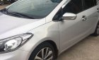 Kia K3     2014 - Cần bán gấp Kia K3 sản xuất năm 2014, màu bạc xe gia đình