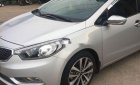 Kia K3     2014 - Cần bán gấp Kia K3 sản xuất năm 2014, màu bạc xe gia đình