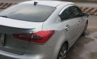 Kia K3     2014 - Cần bán gấp Kia K3 sản xuất năm 2014, màu bạc xe gia đình