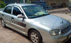 Kia Spectra 2004 - Cần bán gấp Kia Spectra 2004, màu bạc xe nguyên bản