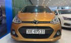 Hyundai Grand i10   2016 - Cần bán lại xe Hyundai Grand i10 1.2AT năm 2016, màu vàng, nhập khẩu  